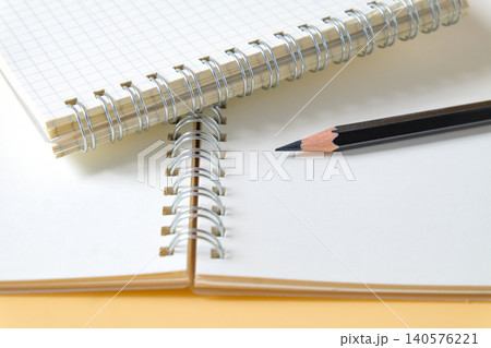 Pencil on spiral-bound book note ,education concept. Pencil on spiral-bound book note ,education concept. 140576221