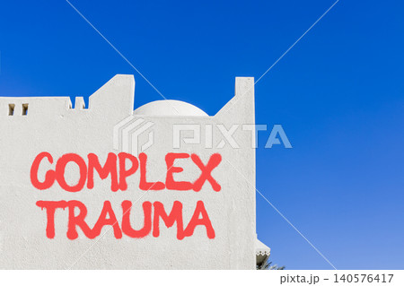 Complex trauma words symbol. Concept words Complex trauma on beautiful white wall. Beautiful blue sky background. Psychological complex trauma support concept. Copy space. Complex trauma words symbol. Concept words Complex trauma on beautiful white wall. Beautiful blue sky background. Psychological complex trauma support concept. Copy space. 140576417