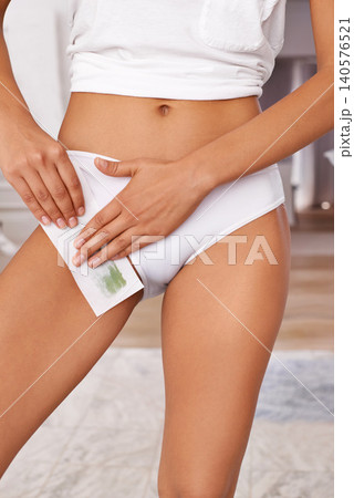 Bikini wax, treatment and woman in home for hair removal and grooming in bathroom. Self care, beauty and closeup of female person underwear with depilation routine for smooth skin at apartment. Bikini wax, treatment and woman in home for hair removal and grooming in bathroom. Self care, beauty and closeup of female person underwear with depilation routine for smooth skin at apartment. 140576521