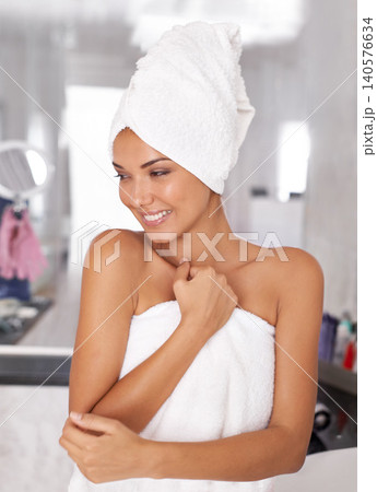 Smile, towel and woman in bathroom with natural beauty, cosmetics and wellness for getting ready. Happy, fresh and female person with health, hygiene and skin routine for self care at apartment. Smile, towel and woman in bathroom with natural beauty, cosmetics and wellness for getting ready. Happy, fresh and female person with health, hygiene and skin routine for self care at apartment. 140576634