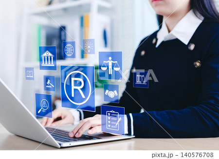 Registered trademark and intellectual property concept. Business professional working with digital trademark, copyright, and intellectual property icons, legal protection, patents, and brand security. Registered trademark and intellectual property concept. Business professional working with digital trademark, copyright, and intellectual property icons, legal protection, patents, and brand security. 140576708