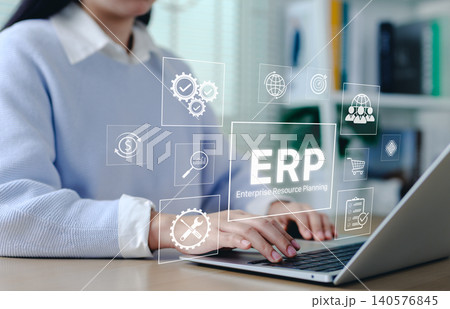 ERP Enterprise Resource Planning system concept. Businesswoman using laptop with interface ERP icons, business automation, data integration, workflow management, and software systems for corporate. 140576845