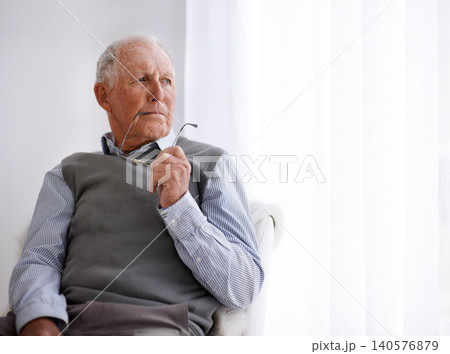 Old man, thinking and lonely for depression on couch, glasses and remember memories or mistake. Senior male person, living room and nostalgia or anxiety on sofa, dementia and Alzheimer in retirement Old man, thinking and lonely for depression on couch, glasses and remember memories or mistake. Senior male person, living room and nostalgia or anxiety on sofa, dementia and Alzheimer in retirement 140576879