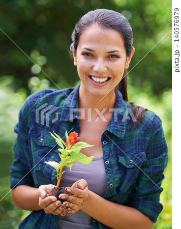 Portrait, flower and smile with woman gardening in backyard of home for growth or sustainability. Face, plant and landscaping with happy young person in garden for cultivation or horticulture Portrait, flower and smile with woman gardening in backyard of home for growth or sustainability. Face, plant and landscaping with happy young person in garden for cultivation or horticulture 140576979