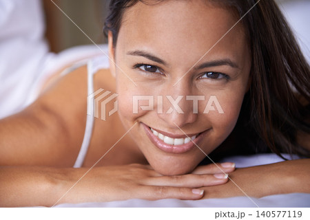 Wake up, smile or portrait of woman in bed for resting to relax in a home, house or apartment. Peace, morning or face of a happy person with wellness, comfortable mattress or confidence in bedroom 140577119