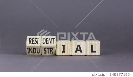 Industrial or residential symbol. Concept words Industrial or Residential on beautiful wooden blocks. Beautiful grey background. Business industrial or residential concept. Copy space. Industrial or residential symbol. Concept words Industrial or Residential on beautiful wooden blocks. Beautiful grey background. Business industrial or residential concept. Copy space. 140577196