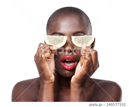 Woman, surprise and lemon skincare in studio for organic dermatology routine, youth or wellness. White background, shock and African model with facial glow, fruit diet and eyes product for beauty Woman, surprise and lemon skincare in studio for organic dermatology routine, youth or wellness. White background, shock and African model with facial glow, fruit diet and eyes product for beauty 140577332