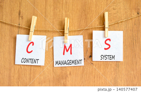 CMS content management system symbol. Concept words CMS content management system on beautiful white papers. Beautiful wooden background. Business CMS content management system concept. Copy space. CMS content management system symbol. Concept words CMS content management system on beautiful white papers. Beautiful wooden background. Business CMS content management system concept. Copy space. 140577407