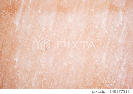 pink orange wall texture with traces of white whitewash 140577515