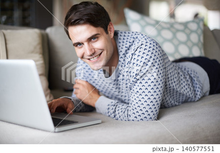 Man, home and smile in sofa with laptop to browse internet for streaming service and entertainment. Male person, living room and happy on couch with website for online information and news update Man, home and smile in sofa with laptop to browse internet for streaming service and entertainment. Male person, living room and happy on couch with website for online information and news update 140577551
