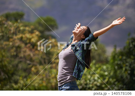 Freedom, joy and relax for woman in outdoor, garden or forest for bliss, satisfaction and fulfillment. Young person, smile with arm in air for optimism, happiness and excited in environment on mockup 140578106