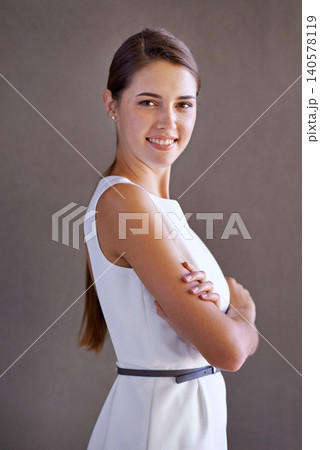 Portrait, happy woman or arms crossed on gray background for ambition and confident person by studio. French lady, designer and smile on face for career growth and positive attitude in creative job Portrait, happy woman or arms crossed on gray background for ambition and confident person by studio. French lady, designer and smile on face for career growth and positive attitude in creative job 140578119