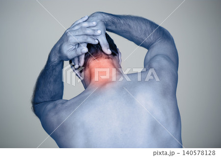 Studio, man and hands for neck pain or tension with muscle inflammation, discomfort and sprain of stress or strain. Red glow, back view and person with body ache, injury and bruise on grey background 140578128