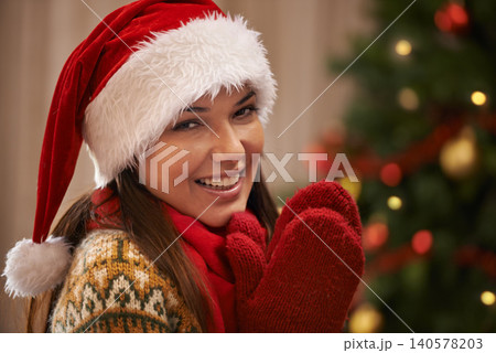 Portrait, smile and woman in home for Christmas, party or holiday with gloves. Xmas, face and happy female person in hat for festive celebration, tradition and bokeh on tree in Spain in apartment Portrait, smile and woman in home for Christmas, party or holiday with gloves. Xmas, face and happy female person in hat for festive celebration, tradition and bokeh on tree in Spain in apartment 140578203