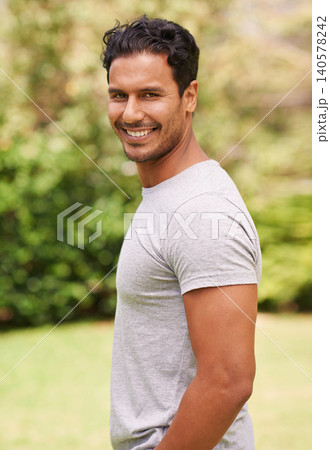 Man, outdoor and portrait on grass, smile and green, plants and garden in nature. Male person, backyard and fashion to relax, summer and vacation at garden or park for peace for wellness and happy Man, outdoor and portrait on grass, smile and green, plants and garden in nature. Male person, backyard and fashion to relax, summer and vacation at garden or park for peace for wellness and happy 140578242