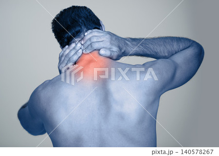 Back pain, injury and body strain from fitness or exercise, stretch and gray background. Tension, hands or joint or muscle on spine for male model, studio and medical from accident with rear view 140578267