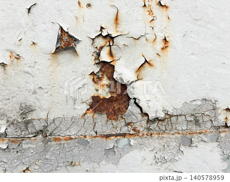 Abstract texture of cracked white paint on a rusty metal surface. Aged background Abstract texture of cracked white paint on a rusty metal surface. Aged background 140578959