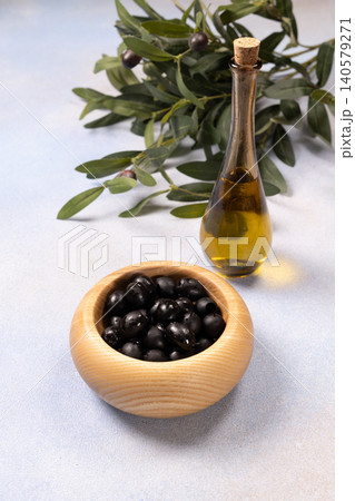 Black olives, olive oil, and branch symbolizing mediterranean diet 140579271