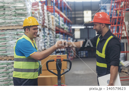 Diversity Teamwork Warehouse worker fist bump together trust partner. Engineer man, women hands partnership. Coworker colleague logistics Warehouse agreement. Multiracial Two people fist bump partner Diversity Teamwork Warehouse worker fist bump together trust partner. Engineer man, women hands partnership. Coworker colleague logistics Warehouse agreement. Multiracial Two people fist bump partner 140579623