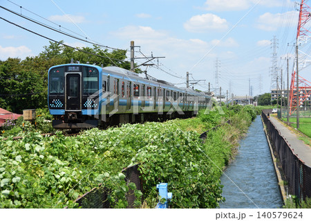 用水路沿いに走るJR相模線E131系 用水路沿いに走るJR相模線E131系 140579624