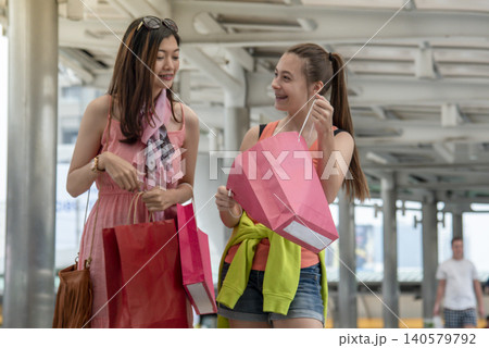 Shopaholic Women holding shopping bags ,money ,credit card person at shopping malls.Fashionable Woman love online website with sales tag on black Friday. E-commerce fashion digital marketing lifestyle Shopaholic Women holding shopping bags ,money ,credit card person at shopping malls.Fashionable Woman love online website with sales tag on black Friday. E-commerce fashion digital marketing lifestyle 140579792