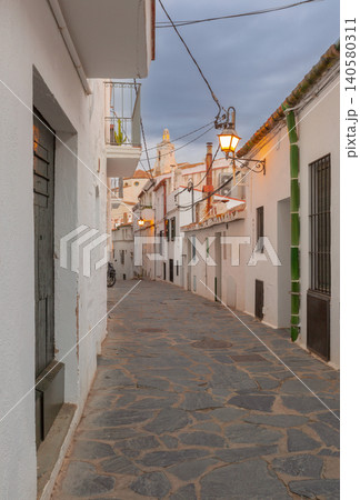 Narrow Stone Street with White Houses in Cadaques Catalonia Spain at Dawn Narrow Stone Street with White Houses in Cadaques Catalonia Spain at Dawn 140580311