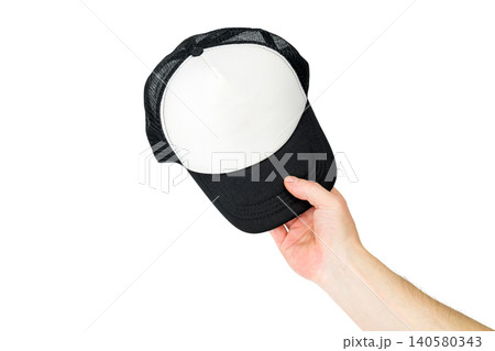 baseball cap in a man hand on a white background from above 140580343