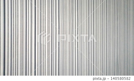 wallpaper texture with thin vertical stripes of gray and black color on a white background wallpaper texture with thin vertical stripes of gray and black color on a white background 140580582