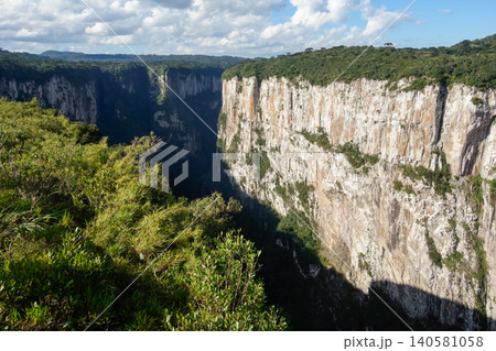 immense walls of basaltic rock forming a huge canyon. Cambara do Sul, RS, Brazil. Itaimbezinho canyon. immense walls of basaltic rock forming a huge canyon. Cambara do Sul, RS, Brazil. Itaimbezinho canyon. 140581058