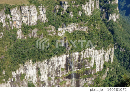 immense walls of basaltic rock forming a huge canyon. Cambara do Sul, RS, Brazil. Fortaleza canyon immense walls of basaltic rock forming a huge canyon. Cambara do Sul, RS, Brazil. Fortaleza canyon 140581072