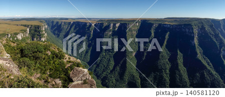 wide view of immense walls of Fortaleza canyon in Cambara do Sul, RS, Brazil. Panoramic 140581120