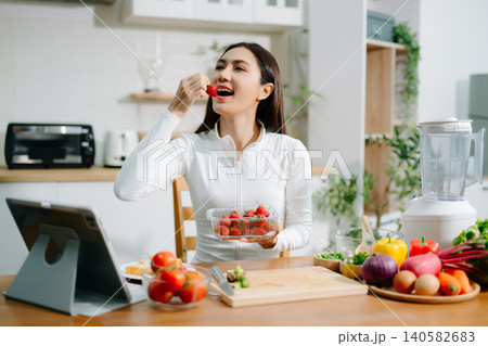 Healthy woman preparing fresh vegetables at home kitchen. Clean eating, nutrition, cooking, wellness lifestyle, vegetarian food, diet concept and healthy living inspiration. Healthy woman preparing fresh vegetables at home kitchen. Clean eating, nutrition, cooking, wellness lifestyle, vegetarian food, diet concept and healthy living inspiration. 140582683