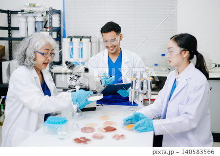 Team of Diverse Asian Scientists Conducting Research in Modern Laboratory Team of Diverse Asian Scientists Conducting Research in Modern Laboratory 140583566