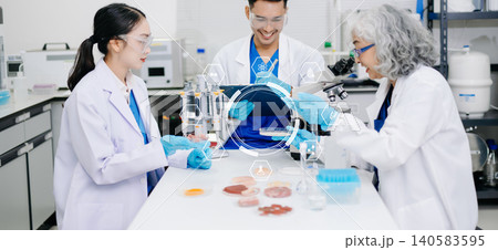 Asian Scientists Collaborating in Medical Laboratory with Futuristic Digital Interface Asian Scientists Collaborating in Medical Laboratory with Futuristic Digital Interface 140583595