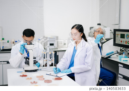 Team of Diverse Asian Scientists Conducting Research in Modern Laboratory Team of Diverse Asian Scientists Conducting Research in Modern Laboratory 140583633