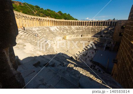 Ancient amphitheater Aspendos a sunny summer day. Antalya. Turkey Ancient amphitheater Aspendos a sunny summer day. Antalya. Turkey 140583814
