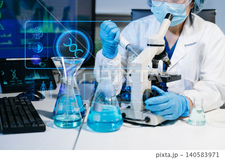 Scientist conducting medical research in modern laboratory using digital healthcare interface, biotechnology analysis, pharmaceutical testing Scientist conducting medical research in modern laboratory using digital healthcare interface, biotechnology analysis, pharmaceutical testing 140583971