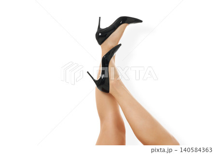 Black high heels worn on legs with a white background, PNG Black high heels worn on legs with a white background, PNG 140584363