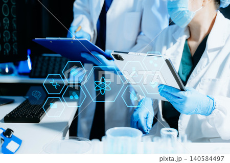 Medical scientists using digital technology and AI tools for laboratory research and diagnostics. Healthcare innovation, biotechnology, data-driven medicine Medical scientists using digital technology and AI tools for laboratory research and diagnostics. Healthcare innovation, biotechnology, data-driven medicine 140584497