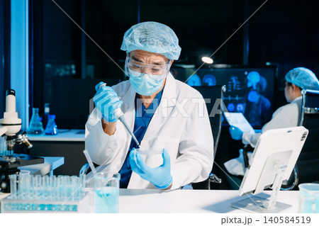 Scientist team meeting and writing analysis results in the laboratory study and analyze scientific sample Scientist team meeting and writing analysis results in the laboratory study and analyze scientific sample 140584519