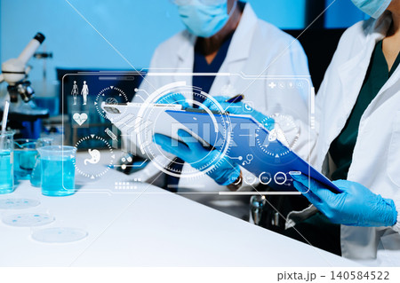 Senior medical scientists working in laboratory, reviewing research data and experiment results, reflecting healthcare, science, teamwork Senior medical scientists working in laboratory, reviewing research data and experiment results, reflecting healthcare, science, teamwork 140584522