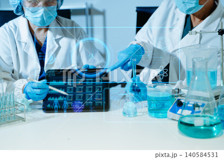 Scientist conducting medical research in modern laboratory using digital healthcare interface, biotechnology analysis, pharmaceutical testing Scientist conducting medical research in modern laboratory using digital healthcare interface, biotechnology analysis, pharmaceutical testing 140584531
