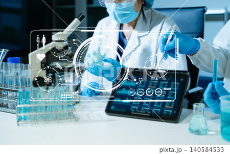 Scientist conducting medical research in modern laboratory using digital healthcare interface, biotechnology analysis, pharmaceutical testing Scientist conducting medical research in modern laboratory using digital healthcare interface, biotechnology analysis, pharmaceutical testing 140584533