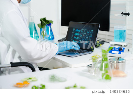 Scientists conduct laboratory food testing and biotech research using advanced equipment, ensuring safety, quality, and innovation in modern science environments. 140584636