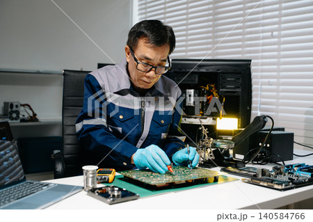 Close up of soldering circuit board, electronics repair process, PCB engineering, hardware maintenance 140584766