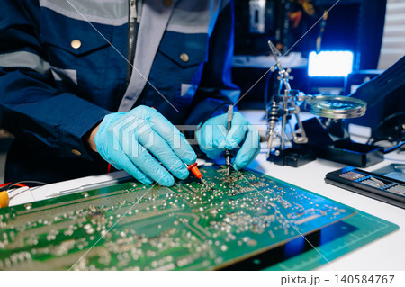 Close up of soldering circuit board, electronics repair process, PCB engineering, hardware maintenance Close up of soldering circuit board, electronics repair process, PCB engineering, hardware maintenance 140584767