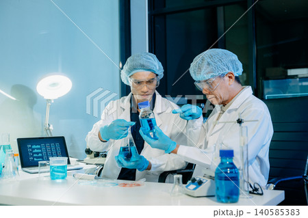 Scientists handshake in laboratory, representing teamwork, medical collaboration, trust, and successful partnership in healthcare research and innovation. Scientists handshake in laboratory, representing teamwork, medical collaboration, trust, and successful partnership in healthcare research and innovation. 140585383