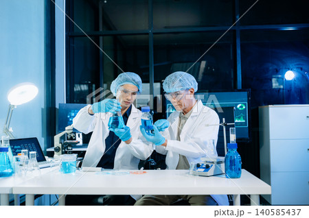 Medical scientists working in laboratory conducting research, testing samples, and analyzing results, showcasing healthcare teamwork, clinical study, and innovation. Medical scientists working in laboratory conducting research, testing samples, and analyzing results, showcasing healthcare teamwork, clinical study, and innovation. 140585437