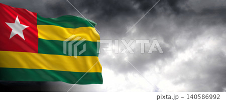 National flag of Togo with dark clouds in the background National flag of Togo with dark clouds in the background 140586992