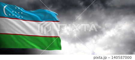 National flag of Uzbekistan with dark clouds in the background 140587000